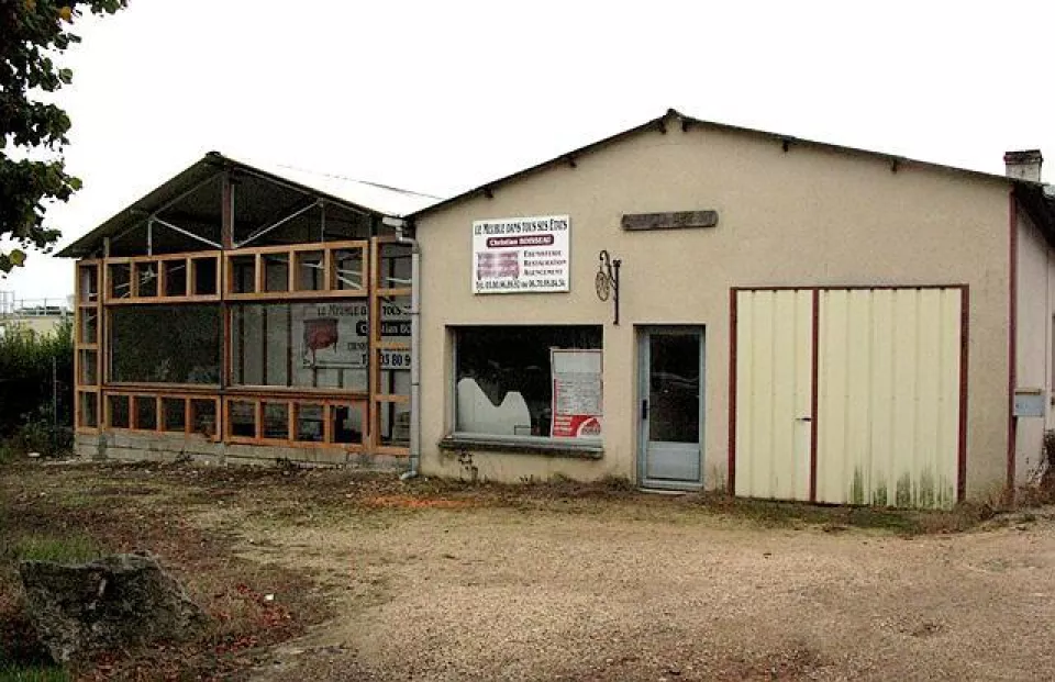 front of woodshop in France