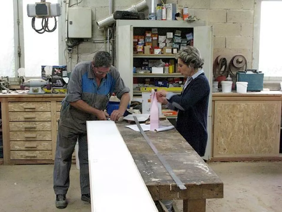 Christian and his wife at the work bench