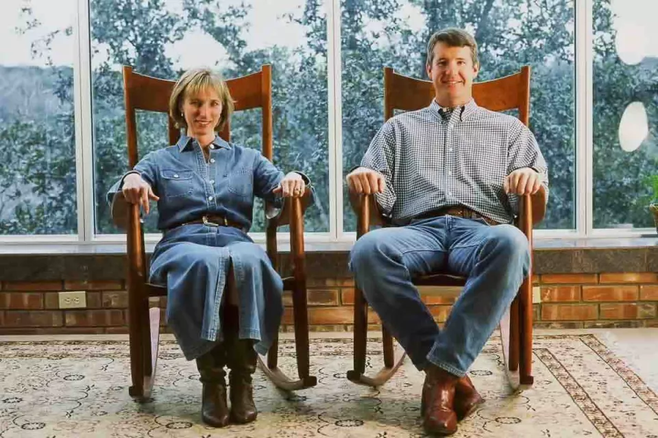 a couple, short and tall, in Weeks rocking chairs