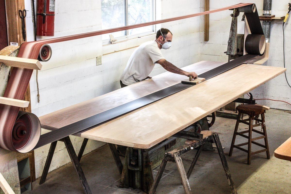 sanding a table top