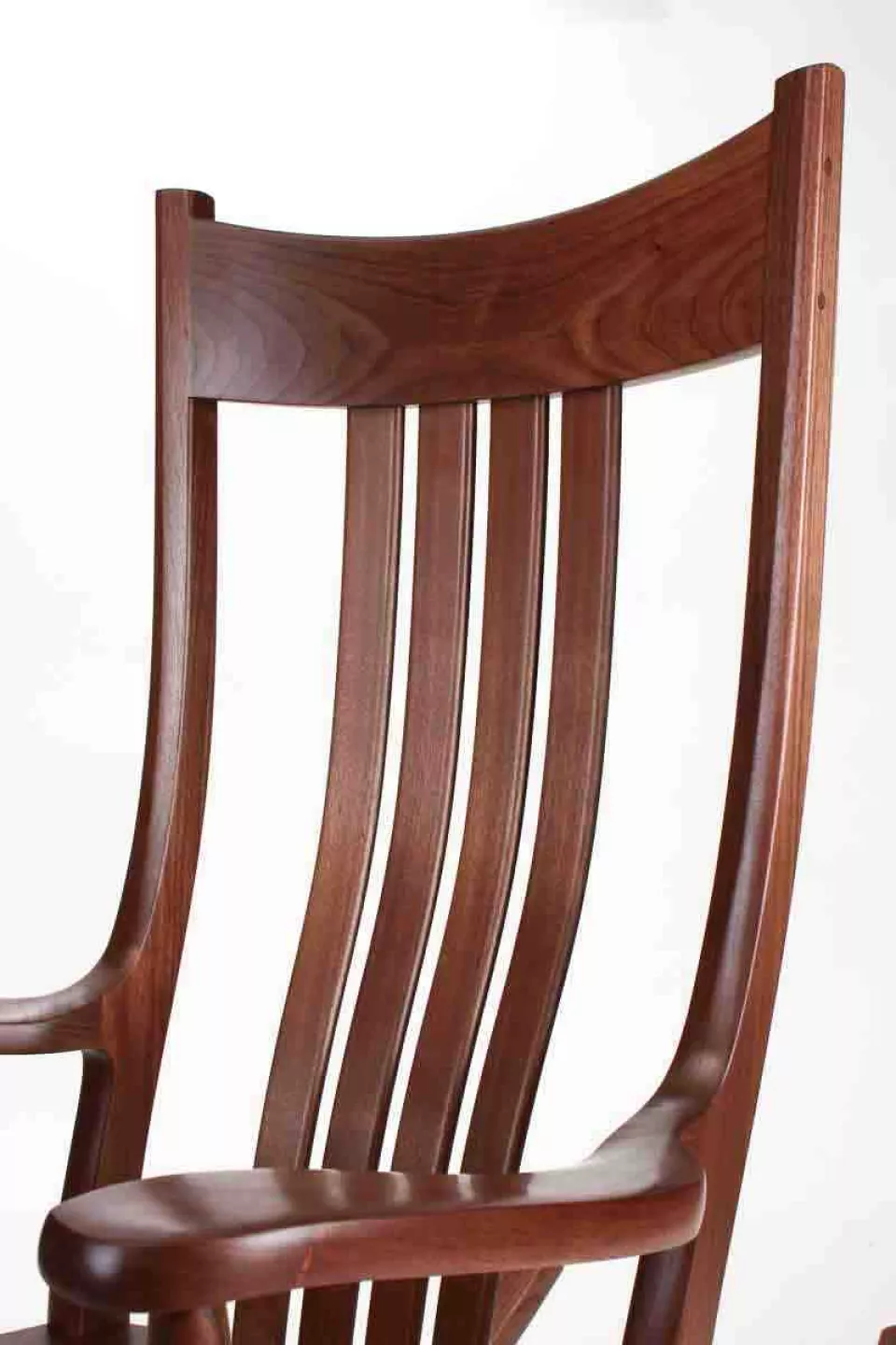 walnut rocking chair closeup of crest