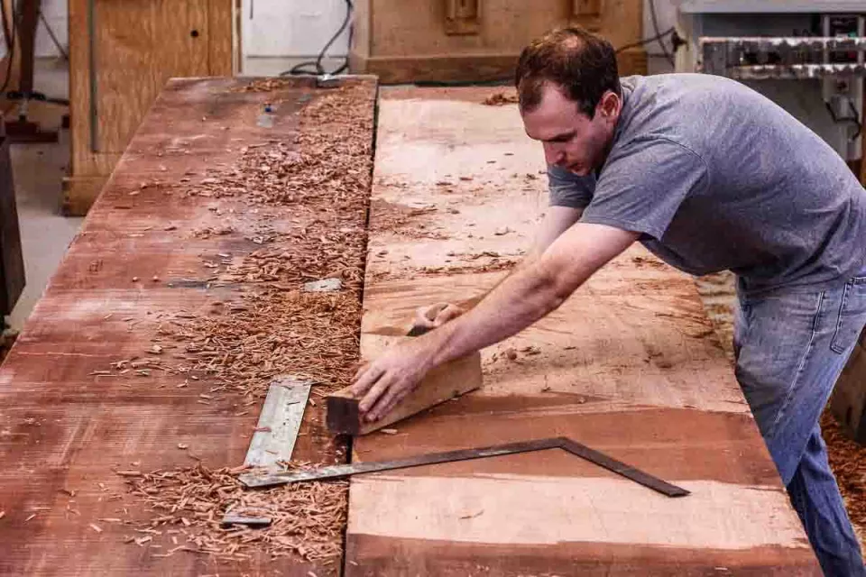 Austin handplaning large mahogany table top
