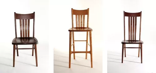 two dining chairs and a barstool in the studio