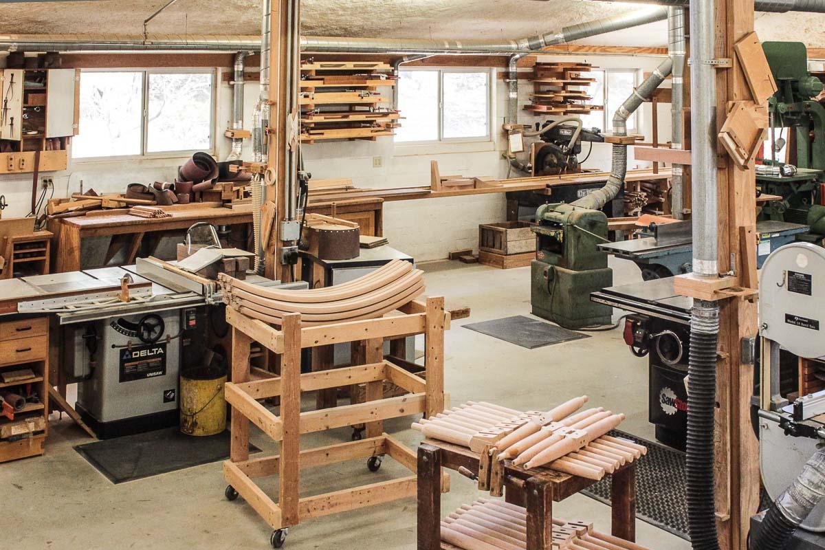 Woodshop with rocking chair parts on dollies