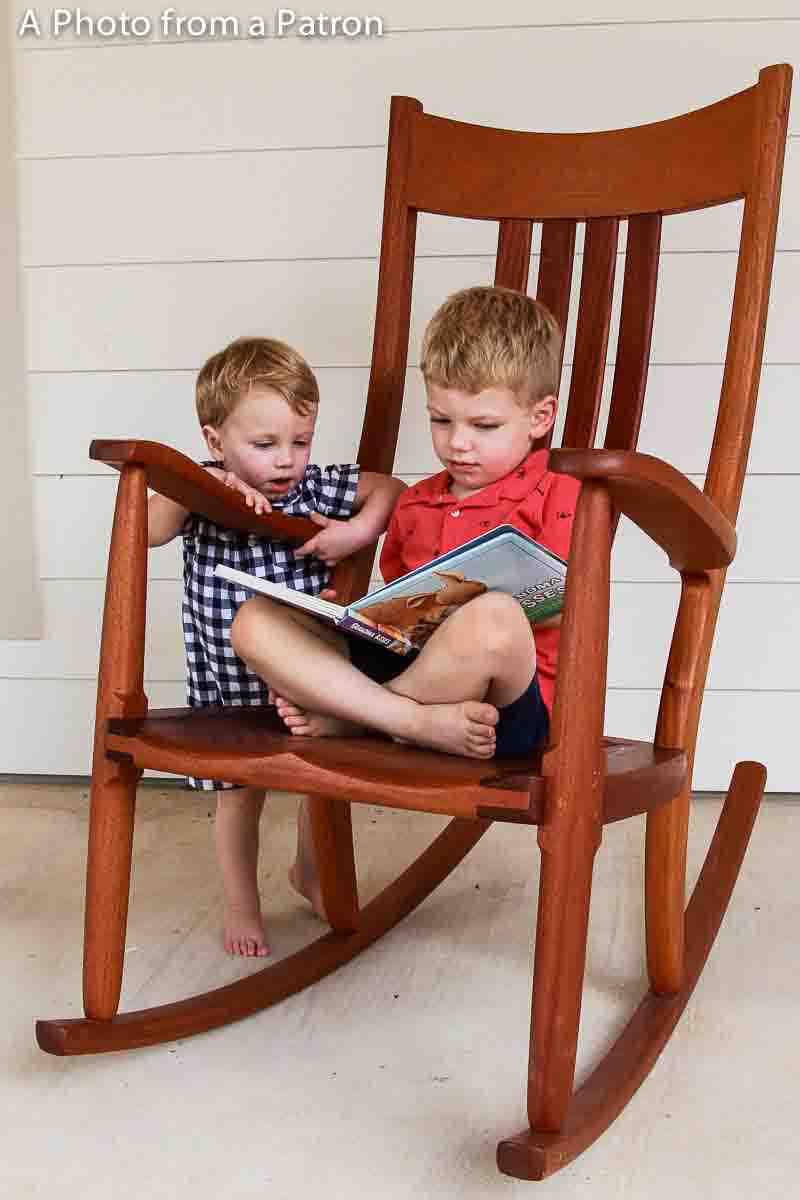 two children in rocking chair