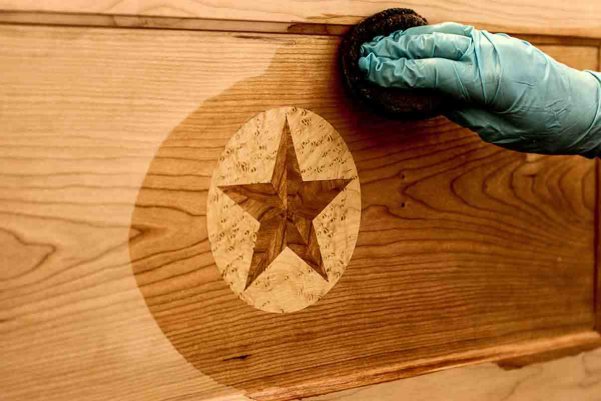 oiling an inlay on a desk