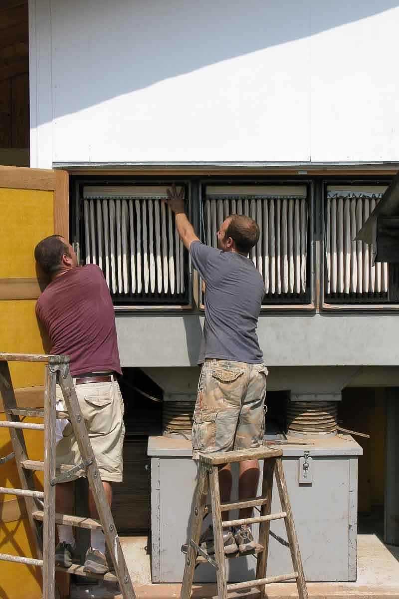 Austin and Aaron changing filters in the bag house