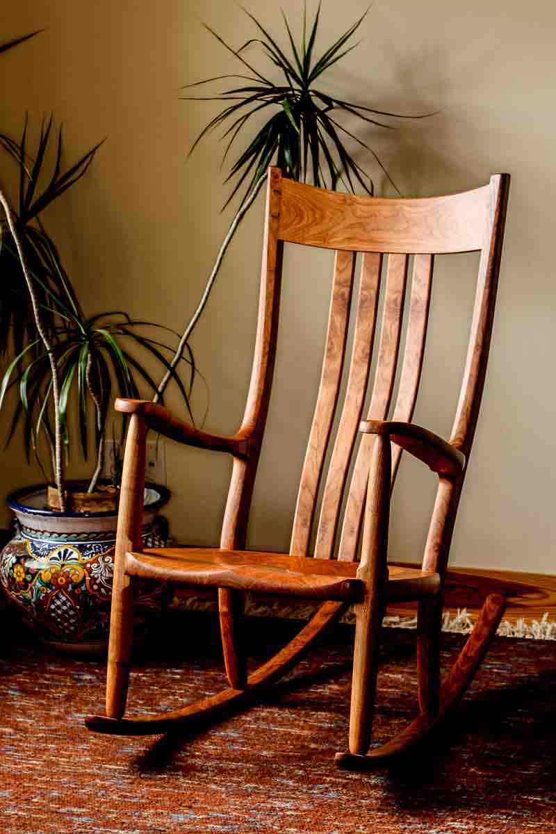 mesquite rocking chair by a plant